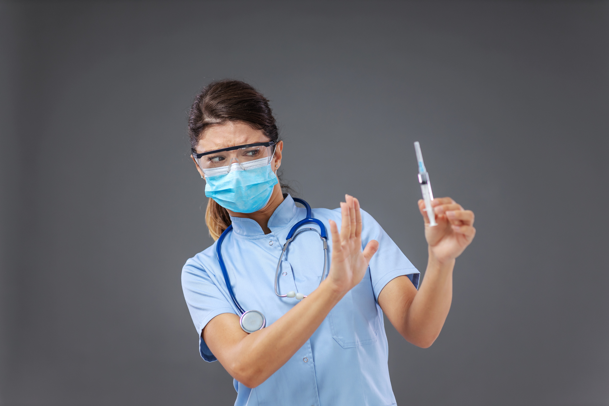 Nurse holding a needle