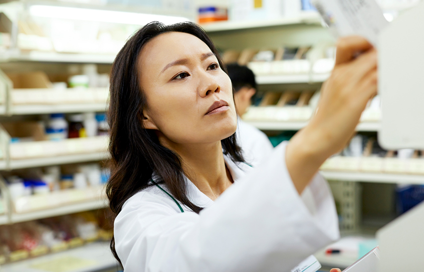 pharmacists filling a prescription