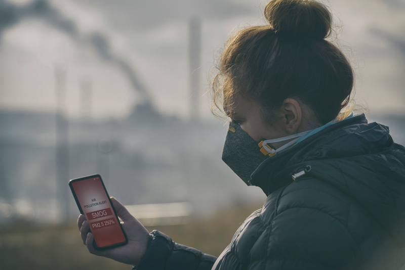 woman wearing mask because of serious smog 