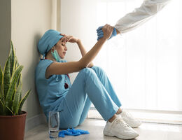 provider on the ground burned out from working too much