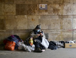 homeless woman in medical mask