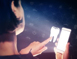 woman looking at phone and searching dental info