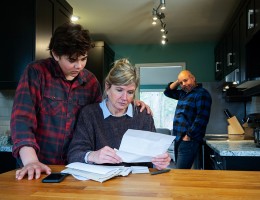 family struggling with home finances and debt