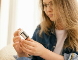 woman looking at prescription bottle