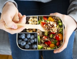 Lunchbox with quinoa salad with tomato and cucumber