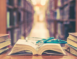book with stethoscope on it in library