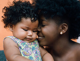 Mother being affectionate with her baby