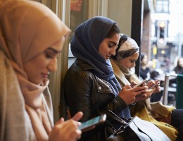 Muslim woman texting