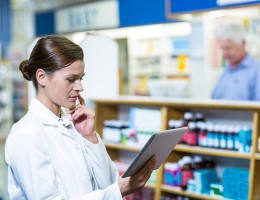 Pharmacist looking at tablet