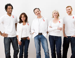 People wearing aids awareness ribbons