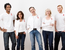 People wearing aids awareness ribbons