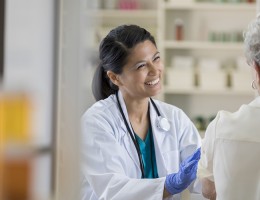 pharmacist smiling at patient 