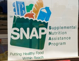 SNAP benefits sign in store window 
