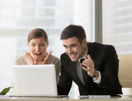 Surprised office people looking at laptop screen 
