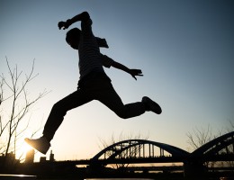 silhouette of young man jumping